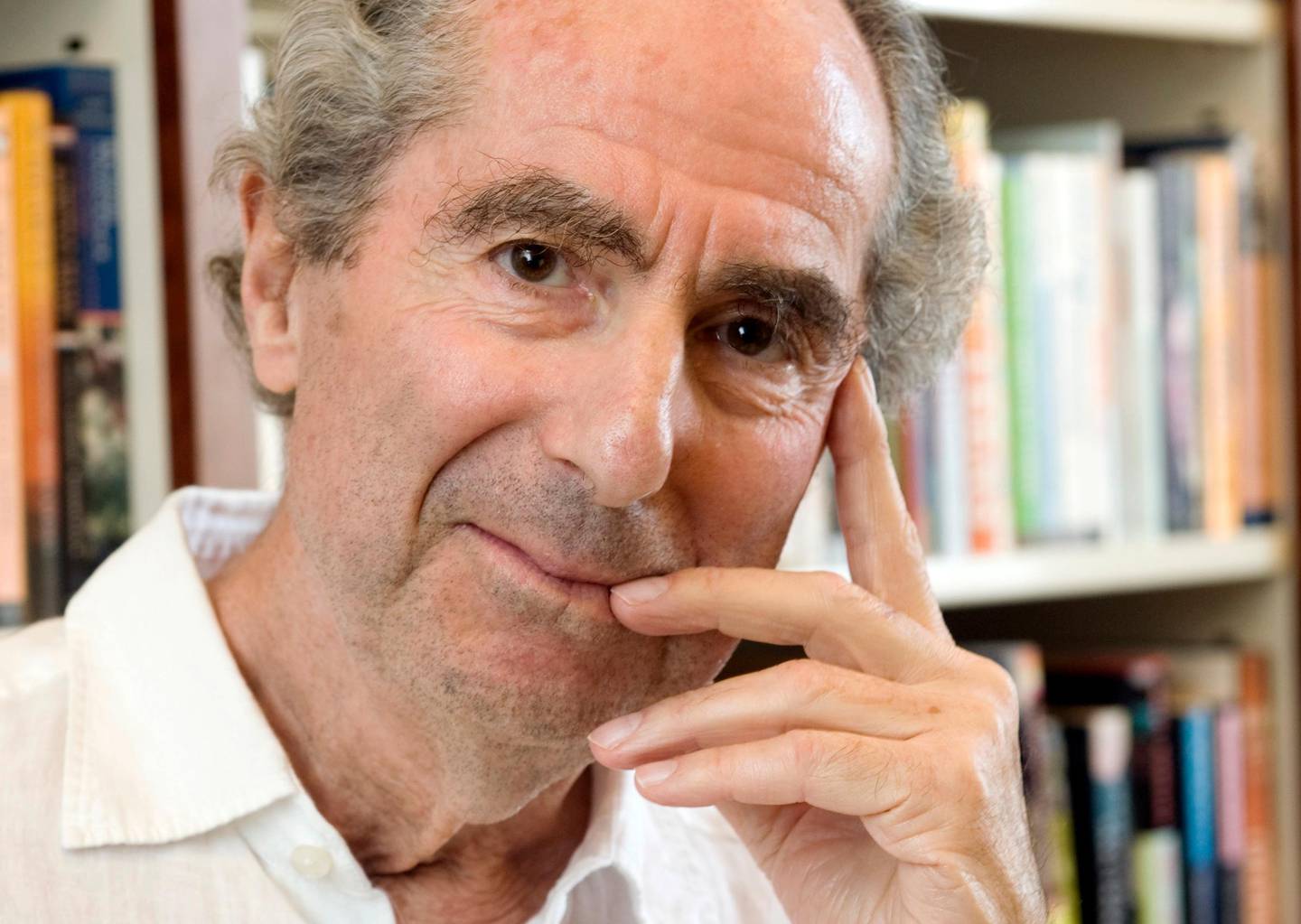 FILE - In this Sept. 8, 2008, file photo, author Philip Roth poses for a photo in the offices of his publisher, Houghton Mifflin, in New York. Roth, prize-winning novelist and fearless narrator of sex, religion and mortality, has died at age 85, his literary agent said Tuesday, May 22, 2018. (AP Photo/Richard Drew, File)