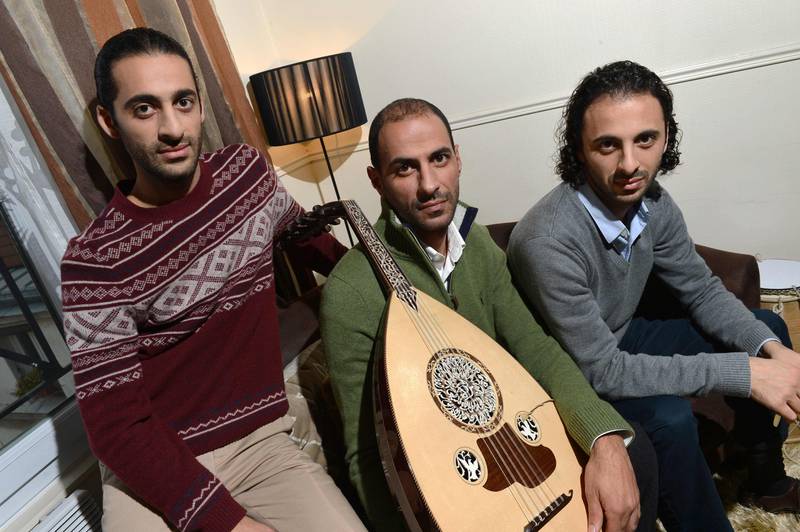 (FILES) In this file photo taken on November 22, 2012 Brothers and members of the Palestinan oud band "Le Trio Joubran", (fromL) Adnan, Samir and Wissam Joubran in Paris. - Le Trio Joubran will perform in the WorldStock music festival which will take place from October 22 until October 28, 2018 in Paris. (Photo by Miguel MEDINA / AFP)