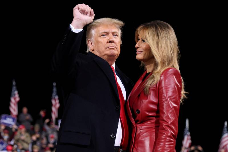U.S. President Donald Trump gestures next to first lady Melania Trump after speaking at a campaign event for Republican U.S. senators David Perdue and Kelly Loeffler in Valdosta, Georgia, U.S., December 5, 2020. REUTERS/Jonathan Ernst     TPX IMAGES OF THE DAY