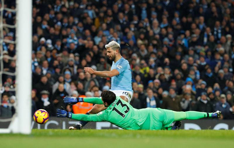 Soccer Football - Premier League - Manchester City v Liverpool - Etihad Stadium, Manchester, Britain - January 3, 2019  Liverpool's Alisson makes a save from Manchester City's Sergio Aguero   REUTERS/Phil Noble  EDITORIAL USE ONLY. No use with unauthorized audio, video, data, fixture lists, club/league logos or "live" services. Online in-match use limited to 75 images, no video emulation. No use in betting, games or single club/league/player publications.  Please contact your account representative for further details.