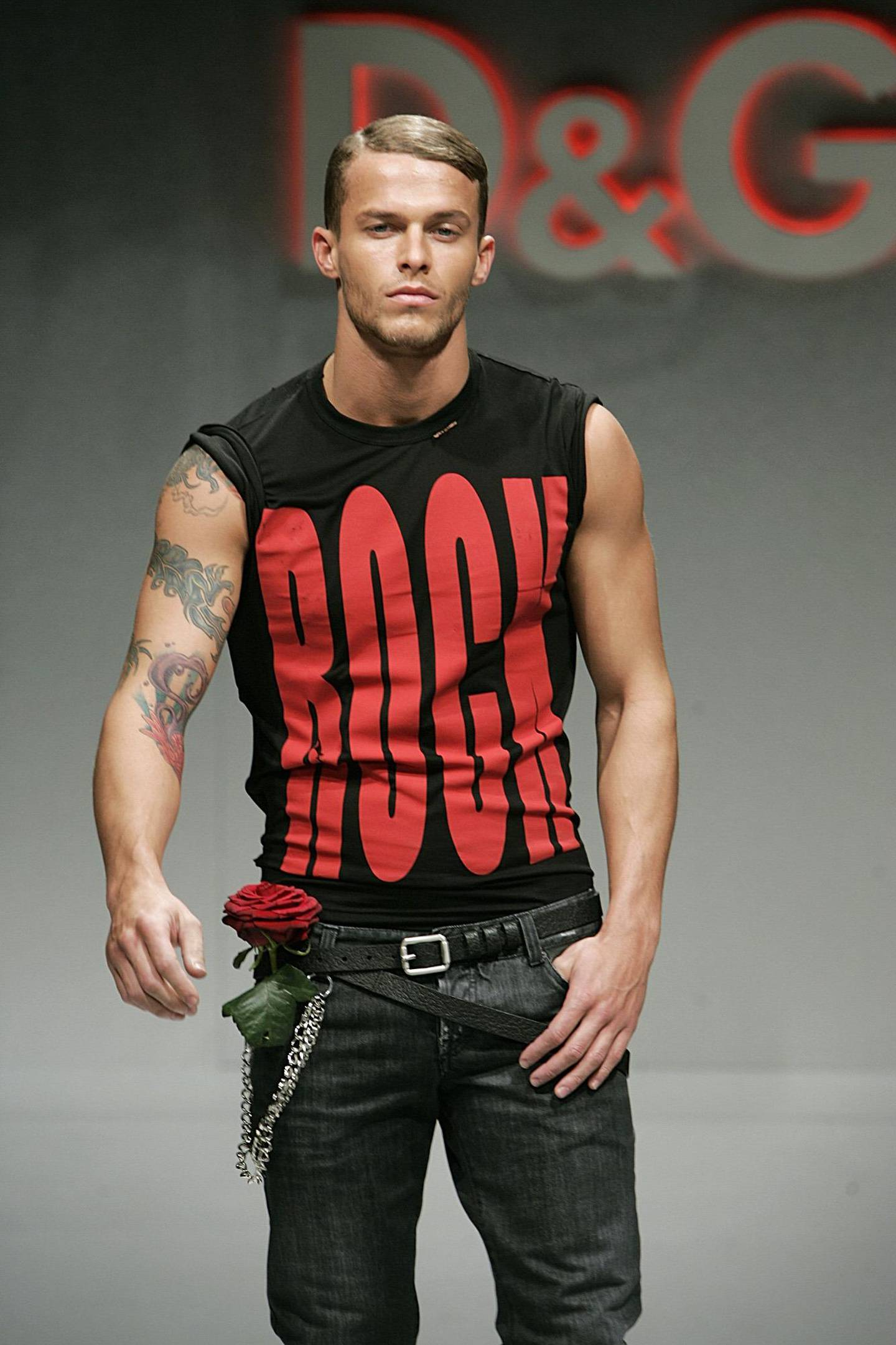A black t-shirt is shown with a rose and jeans at the D&G Fall/Winter 2005/2006 men's collection, presented in Milan, Italy, Tuesday, Jan.18, 2005. (AP Photo/Luca Bruno)
