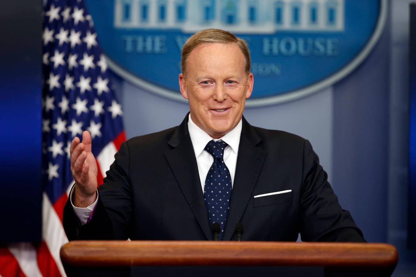 FILE - In this Tuesday, June 20, 2017, file photo, then-White House press secretary Sean Spicer smiles as he answers a question during a briefing at the White House,  in Washington. Spicer, who has a memoir coming out July 24, will make appearances in the summer and fall. (AP Photo/Alex Brandon, File)