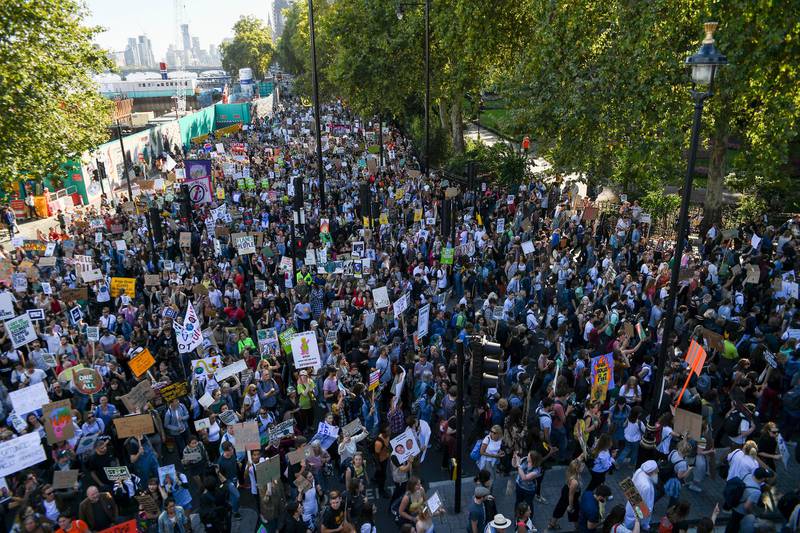 Climate protesters demonstrate in London, Friday, Sept. 20, 2019. In Canberra and Kabul, Cape Town and Berlin, and across the globe, hundreds of thousands of people took the streets Friday to demand that leaders tackle climate change in the run-up to a U.N. summit. (AP Photo/Alberto Pezzali)