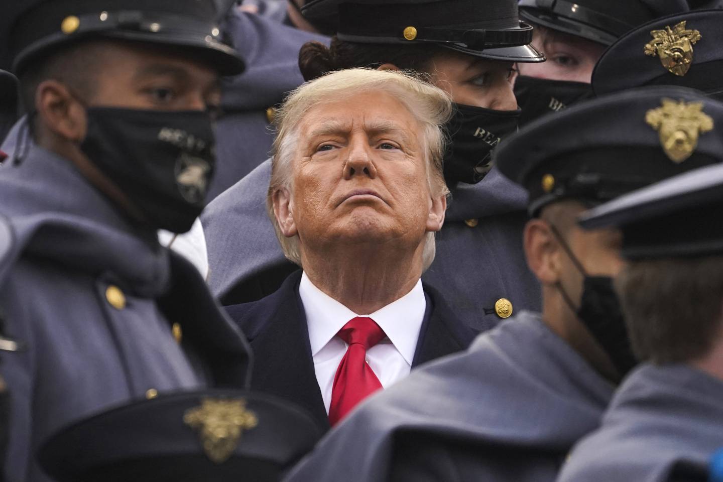 FILE - Surrounded by Army cadets, President Donald Trump watches the first half of the 121st Army-Navy Football Game, Dec. 12, 2020, in West Point, N.Y. When New York's Adult Survivors Act expired on Friday, Nov. 24, 2023, more than 3,700 legal claims had been filed, with many of the last few coming against big-name celebrities and a handful of politicians, such as Trump. (AP Photo/Andrew Harnik, File)