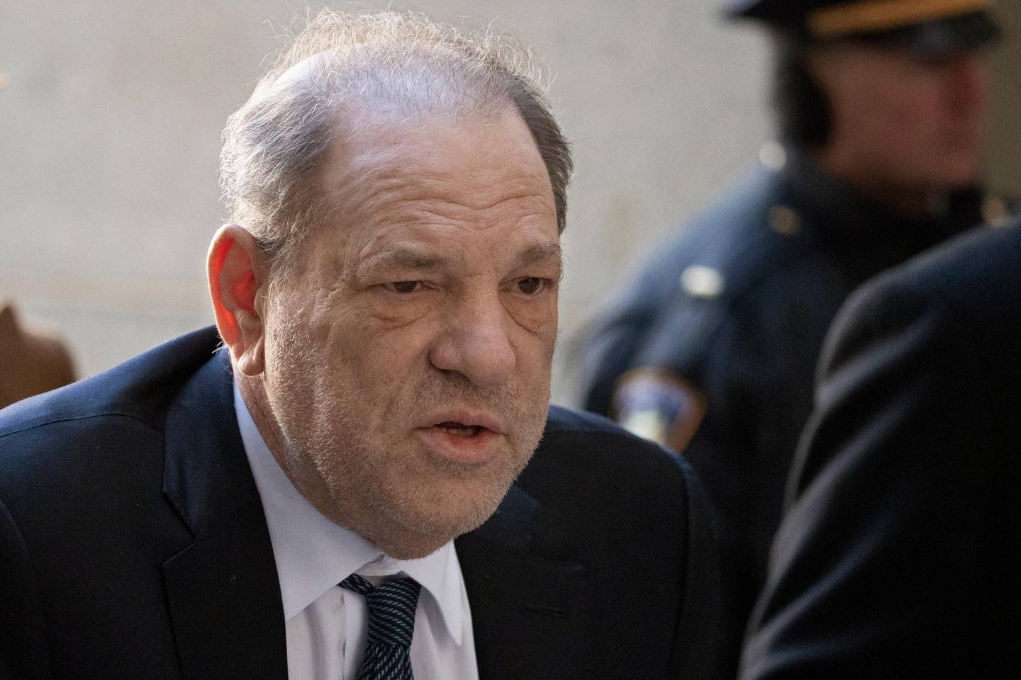 FILE - In this Feb. 21, 2020, file photo, Harvey Weinstein arrives at a Manhattan court as jury deliberations continue in his rape trial in New York. Weinstein tested positive for the coronavirus at a state prison in New York while serving a 23-year sentence for rape and sexual assault, the head of the state correctional officers union said Monday. (AP Photo/Mark Lennihan, File)