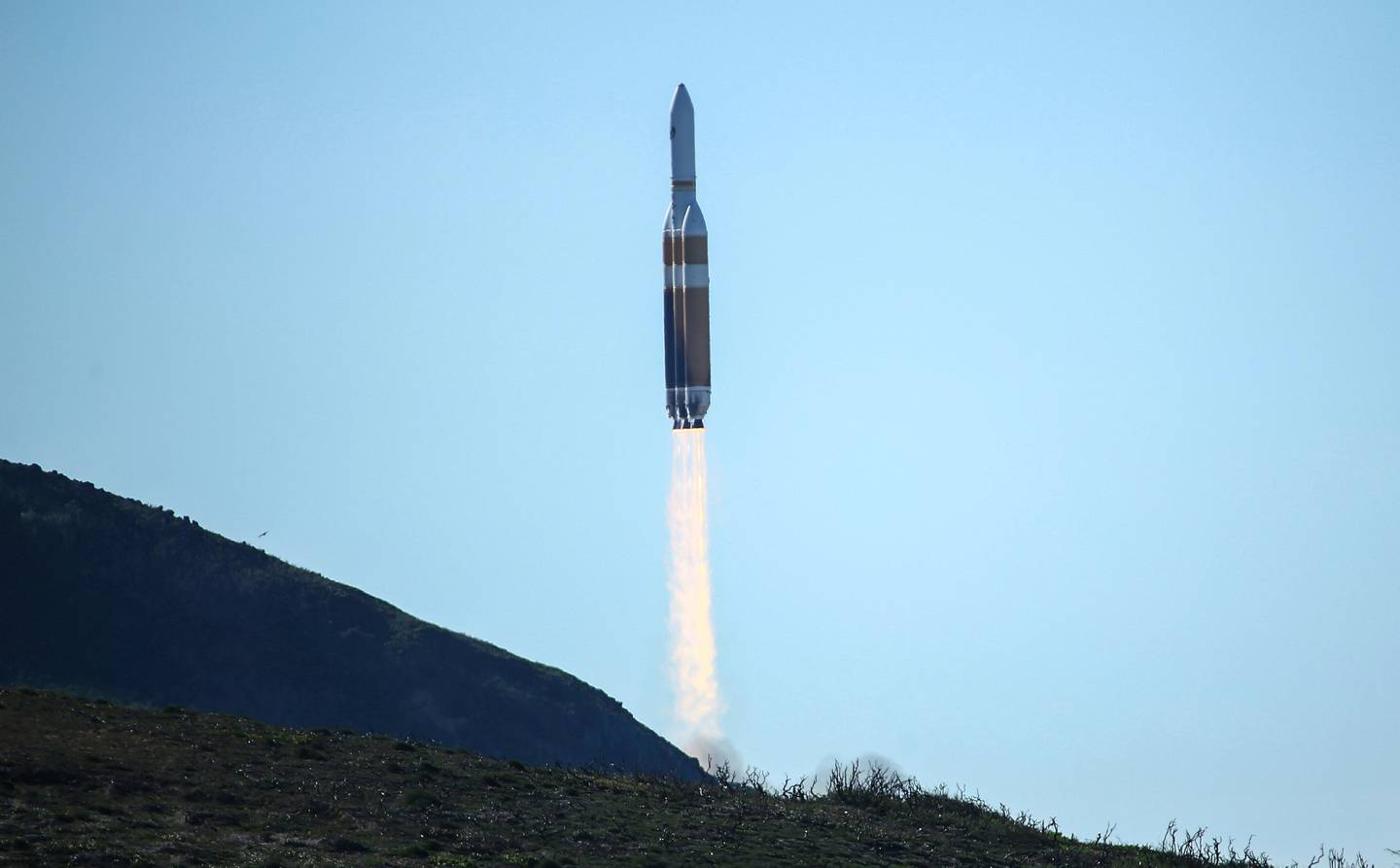 A powerful Delta 4 Heavy rocket carrying a U.S. spy satellite lifts off from Vandenberg Air Force Base in Calif., Saturday, Jan. 19, 2019. The rocket propelled the National Reconnaissance Office satellite at 11:10 a.m. Pacific time, arcing over the Pacific Ocean west of Los Angeles as it headed toward space. The United Launch Alliance Delta 4 Heavy is made up of 3 rocket cores strapped together producing almost 2.2 million pounds of thrust at lift-off. (AP Photo/Matt Hartman)