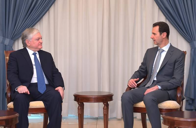 President Assad er stadig mer presset. Her fra et møte onsdag med Armenias utenriksminister. FOTO: NTB SCANPIX