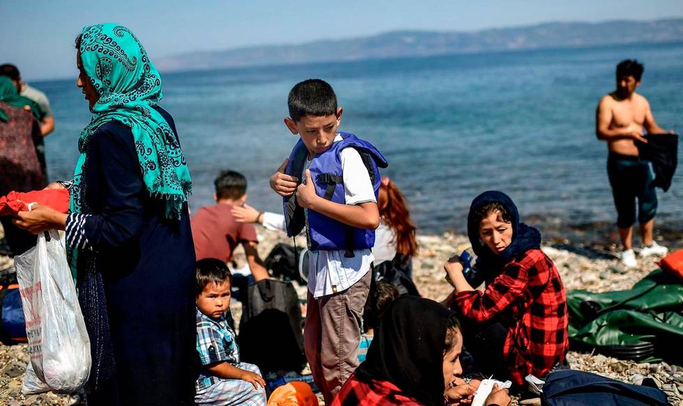 Migrants from Afghanistan arrive after crossing the Aegean Sea from Turkey with a dinghy on the Greek Mediterranean island of Lesbos on August 6, 2018.
More than 1,500 refugees and migrants have died trying to cross the Mediterranean Sea to Europe in the first seven months of this year, over half of them in June and July, the UN refugee agency said on August 3, 2018. / AFP PHOTO / Aris MESSINIS
