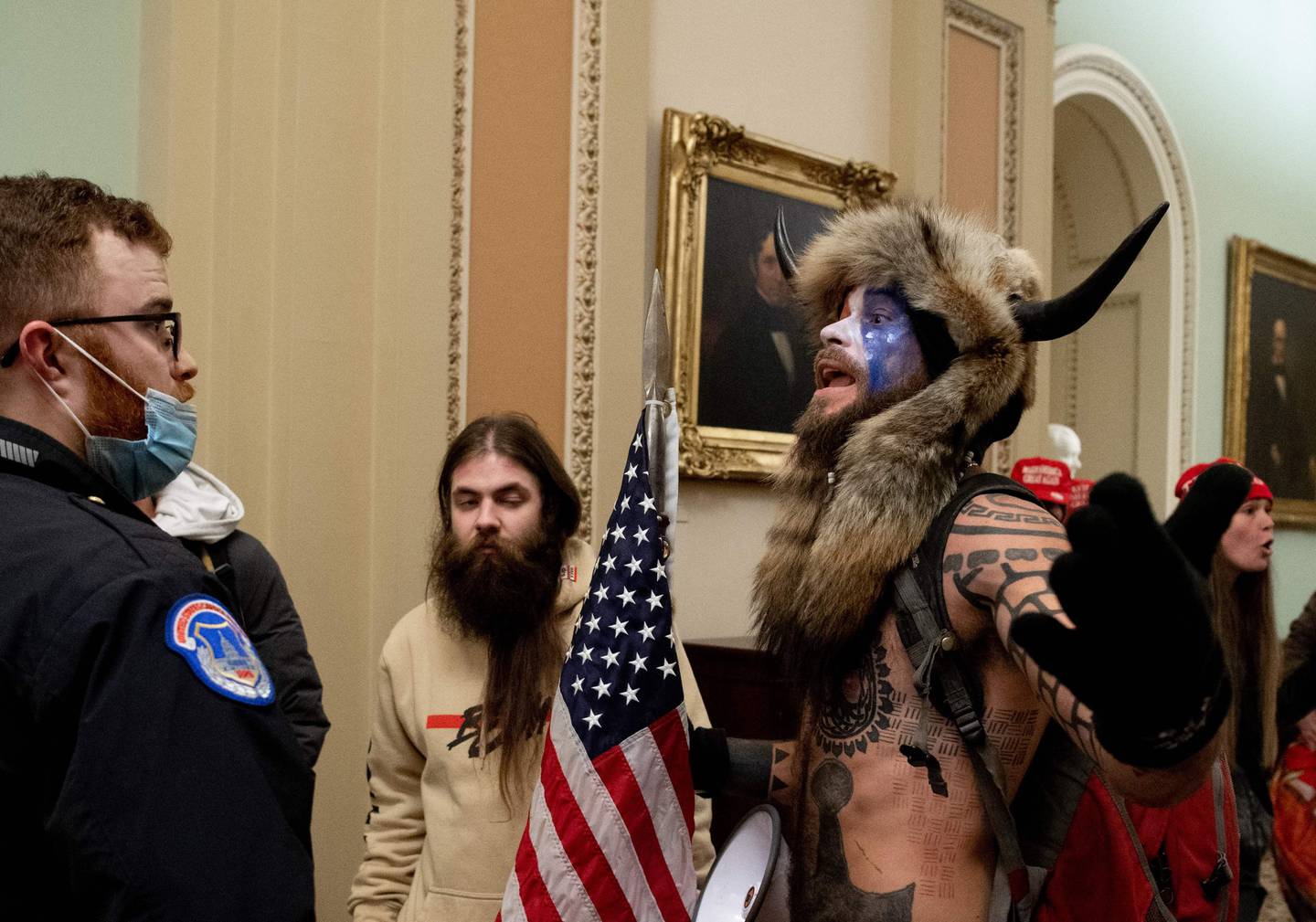Supporters of US President Donald Trump confront Capitol police officers at the US Capitol on January 6, 2021, in Washington, DC. - Demonstrators breeched security and entered the Capitol as Congress debated the a 2020 presidential election Electoral Vote Certification. (Photo by SAUL LOEB / AFP)