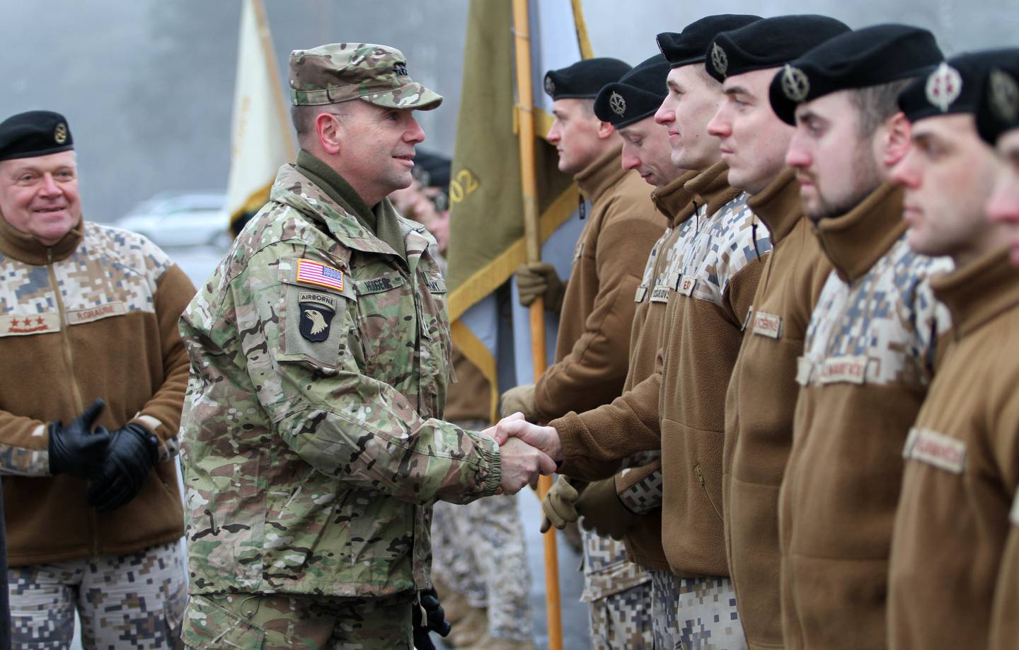 In this January 19, 2015 US Amry handout photo, Lt. Gen. Ben Hodges(C), commander of US Army thanks Latvian soldiers at Operation Atlantic Resolve's official welcome ceremony for 2nd Cavalry Regiment in Adazi, Latvia. Looking on is Lt. Gen. Raimond Graube(L), Latvian National Armed Forces commander.  AFP PHOTO /HANDOUT / US ARMY / PFC JACCOB HEARN                     == RESTRICTED TO EDITORIAL USE / MANDATORY CREDIT: "AFP PHOTO / HANDOUT / US ARMY / PFC JACCOB HEARN "/ NO MARKETING / NO ADVERTISING CAMPAIGNS / NO A LA CARTE SALES / DISTRIBUTED AS A SERVICE TO CLIENTS ==