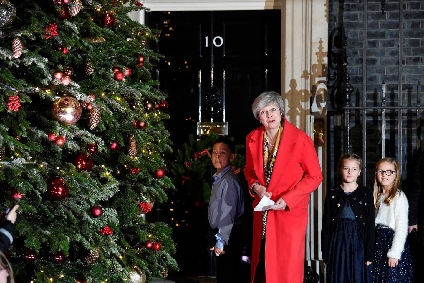 Britain's Prime Minister, Theresa May, looks on during the ceremony of switching on the lights of the Christmas tree in Downing Street, in central London, Britain December 6, 2018.  REUTERS/ Toby Melville