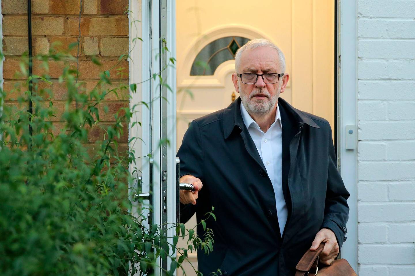 Britain's main opposition Labour Party leader Jeremy Corbyn leaves his home in London on October 19, 2019. - British MPs gather on October 19 for a historic vote on the government's Brexit deal, a decision that could see the UK leave the EU this month or plunge the country into fresh uncertainty. (Photo by ISABEL INFANTES / AFP)