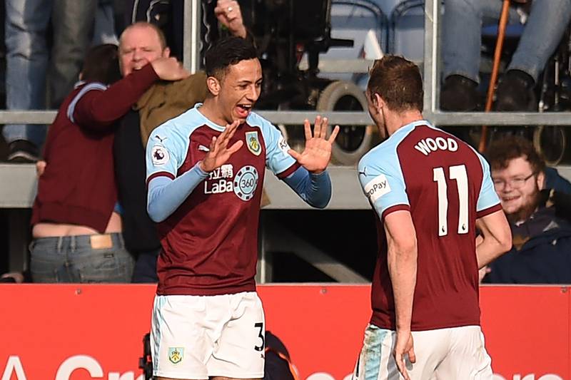 Burnley's English midfielder Dwight McNeil (L) celebrates with Burnley's New Zealand striker Chris Wood (R) after scoring their second goal during the English Premier League football match between Burnley and Wolverhampton Wanderers at Turf Moor in Burnley, north west England on March 30, 2019. (Photo by Oli SCARFF / AFP) / RESTRICTED TO EDITORIAL USE. No use with unauthorized audio, video, data, fixture lists, club/league logos or 'live' services. Online in-match use limited to 120 images. An additional 40 images may be used in extra time. No video emulation. Social media in-match use limited to 120 images. An additional 40 images may be used in extra time. No use in betting publications, games or single club/league/player publications. / 