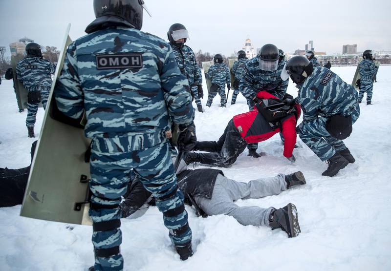 Police detain men during a protest against the jailing of opposition leader Alexei Navalny in Yekaterinburg, Russia, Saturday, Jan. 23, 2021. Russian police on Saturday arrested hundreds of protesters who took to the streets in temperatures as low as minus-50 C (minus-58 F) to demand the release of Alexei Navalny, the country's top opposition figure. A Navalny, President Vladimir Putin's most prominent foe, was arrested on Jan. 17 when he returned to Moscow from Germany, where he had spent five months recovering from a severe nerve-agent poisoning that he blames on the Kremlin. (AP Photo/Anton Basanayev)