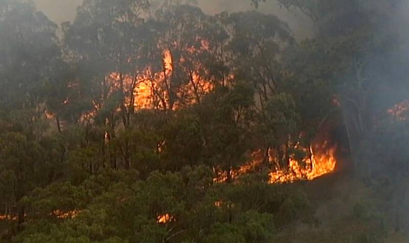 In this image made from video, an aerial scene showsfires burning in Bundoora, Victoria state, Monday, Dec. 30, 2019. New Years Eve fireworks in Australias capital and other cities have been canceled as the wildfire danger worsens in oppressive summer heat, and pressure was building for Sydneys iconic celebrations to be similarly scrapped. (Australian Broadcasting Corporation, Channel 7, Channel 9 via AP)