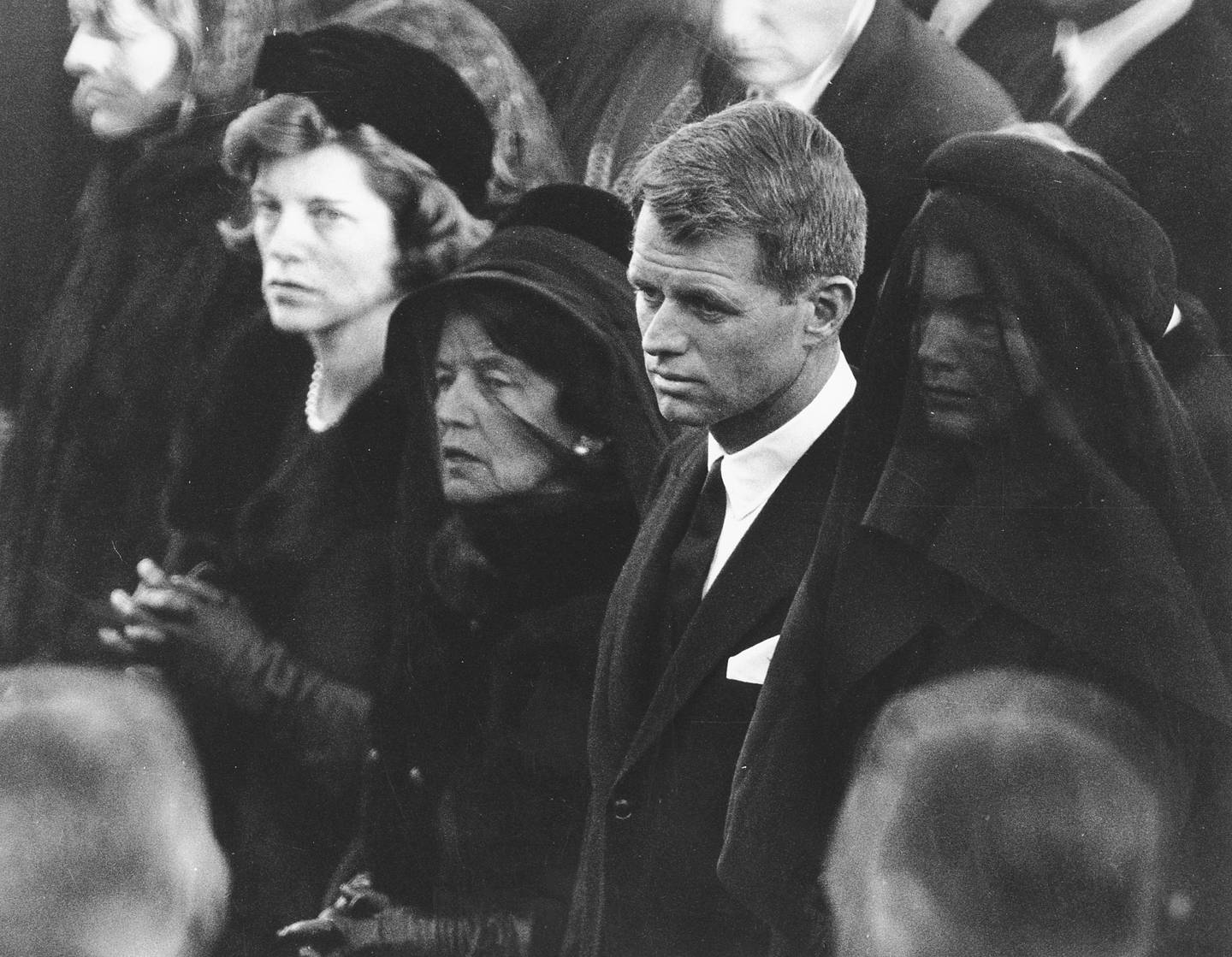 FILE - In this Nov. 25, 1963 file photo members of the Kennedy family attend U.S. President John F. Kennedy's burial at Arlington National Cemetery in Arlington, Va., including JFK's mother, Rose Kennedy, center left with veil; his brother U.S. Attorney General Robert F. Kennedy, center right; and the president's widowed wife, Jacqueline Kennedy, far right. Robert F. Nearly 50 years after Robert F. Kennedy's assassination, a new documentary series on his life and transformation into a liberal hero is coming to Netflix. "Bobby Kennedy for President" produced by RadicalMedia, Trilogy Films and LooksFilm launches Friday, April 27, 2018, on Netflix. (AP Photo, File)