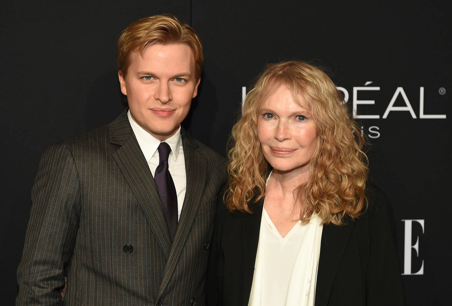 Actress Mia Farrow, right, recipient of the ELLE Legend Award, poses with her son journalist Ronan Farrow at the 25th Annual ELLE Women in Hollywood Celebration, Monday, Oct. 15, 2018, in Los Angeles. (Photo by Chris Pizzello/Invision/AP)