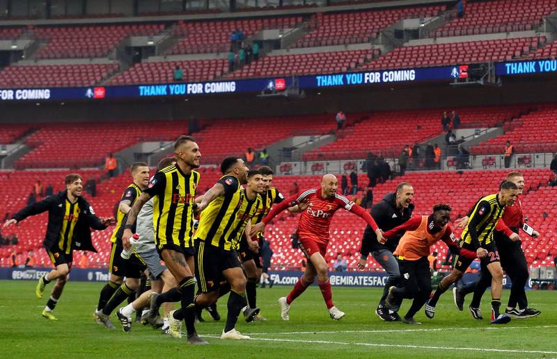 Watford players celebrate at the end of the English FA Cup semifinal soccer match between Watford and Wolverhampton Wanderers at Wembley Stadium in London, Sunday, April 7, 2019. Watford won 3-2. (AP Photo/Tim Ireland)