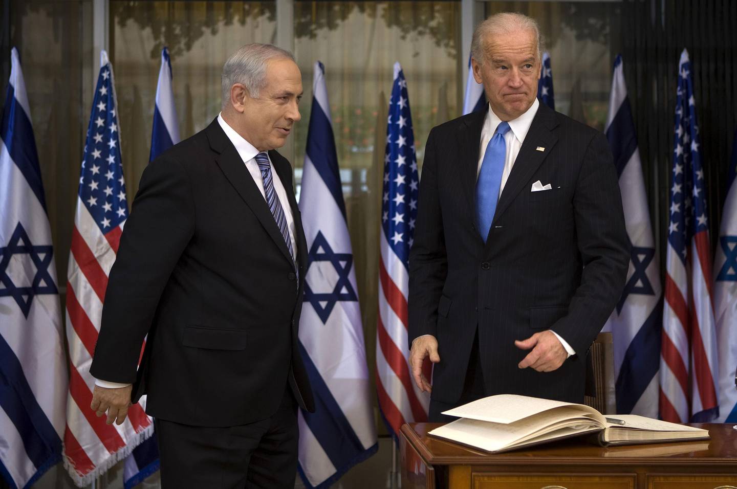 US Vice President Joe Biden (R) stands alongside Israeli Prime Minister Benjamin Netanyahu (L) prior to their meeting at the Prime Minister's residence in Jerusalem on March 9, 2010. US Vice President Joe Biden was meeting top Israeli officials, throwing his weight behind a renewal of Middle East peace talks more than a year after negotiations shuddered to a halt. AFP PHOTO/DAVID FURST