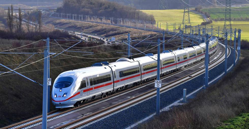 A special Inter City Express train of Deutsche Bahn, DB,drives along the new fast railway track between Munich and Berlin in Erfurt, Germany, Friday, Dec. 8, 2017. Deutsche Bahn said Friday the new line will shave up to two hours off the current trip between northeastern Germany and Bavaria with high-speed trains able to travel up to 300 kph (185 mph) and complete the journey in just under four hours. (Martin Schutt/dpa via AP)