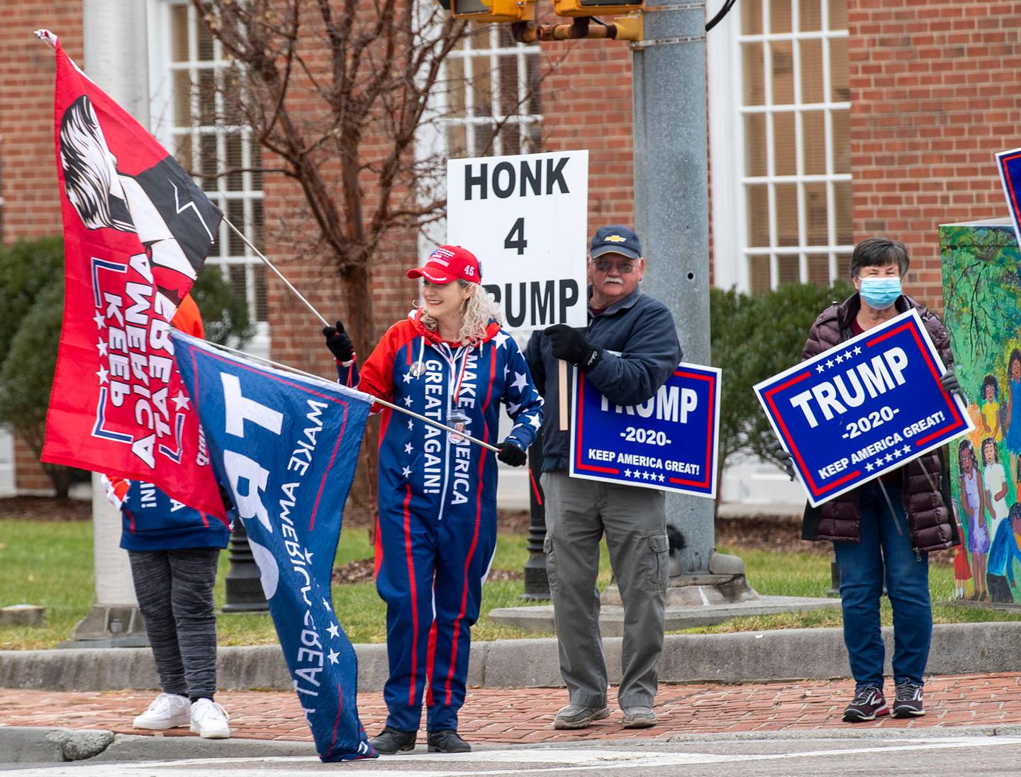 Members of the Southwest Virginia Tea Party gathered in Abingdon, Va., Wednesday afternoon, Jan. 6, 2020, to show their support for President Donald Trump and join the "Stop the Steal" movement. About 50 supporters of the President gathered on the four corners of Main Street and Cummings Avenue to show their support. (David Crigger/Bristol Herald Courier via AP)