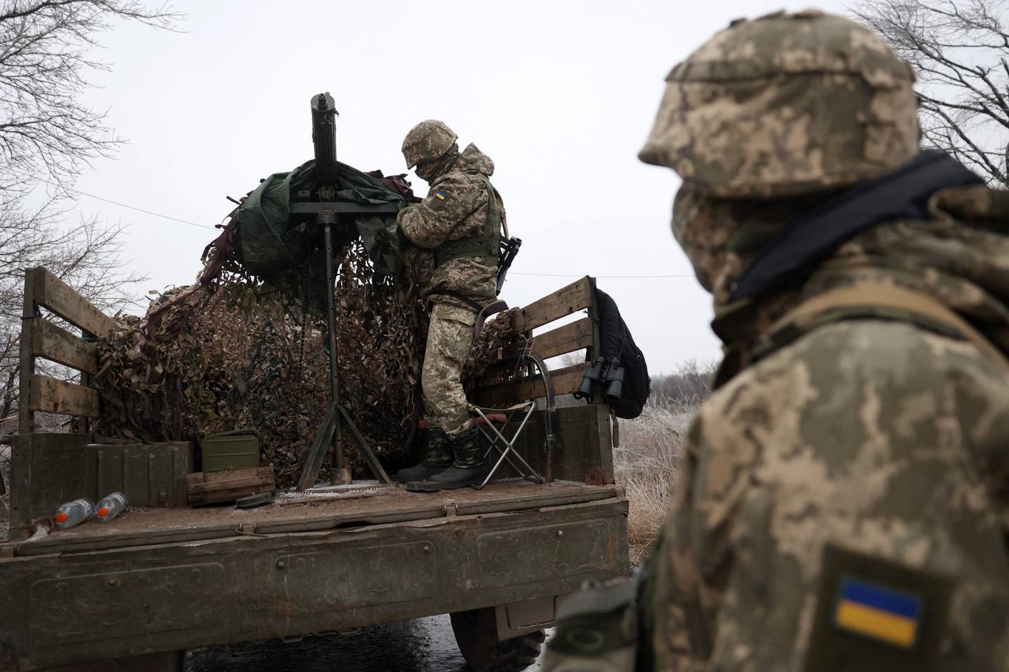 Ukrainian soldiers stand at their position in the Donetsk region, on December 10, 2023, amid the Russian invasion of Ukraine. (Photo by Anatolii Stepanov / AFP)
