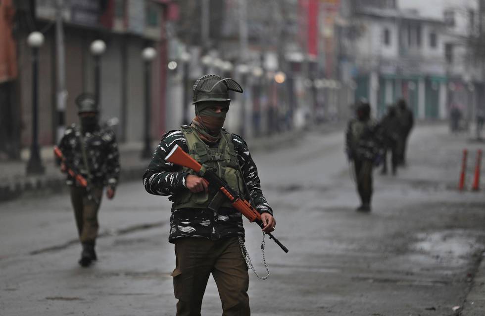 Indian soldiers patrol at a closed market on Indian Republic day in Srinagar, Indian controlled Kashmir, Sunday, Jan. 26, 2020. The day marks the anniversary of India's democratic constitution taking force in 1950. (AP Photo/Mukhtar Khan)