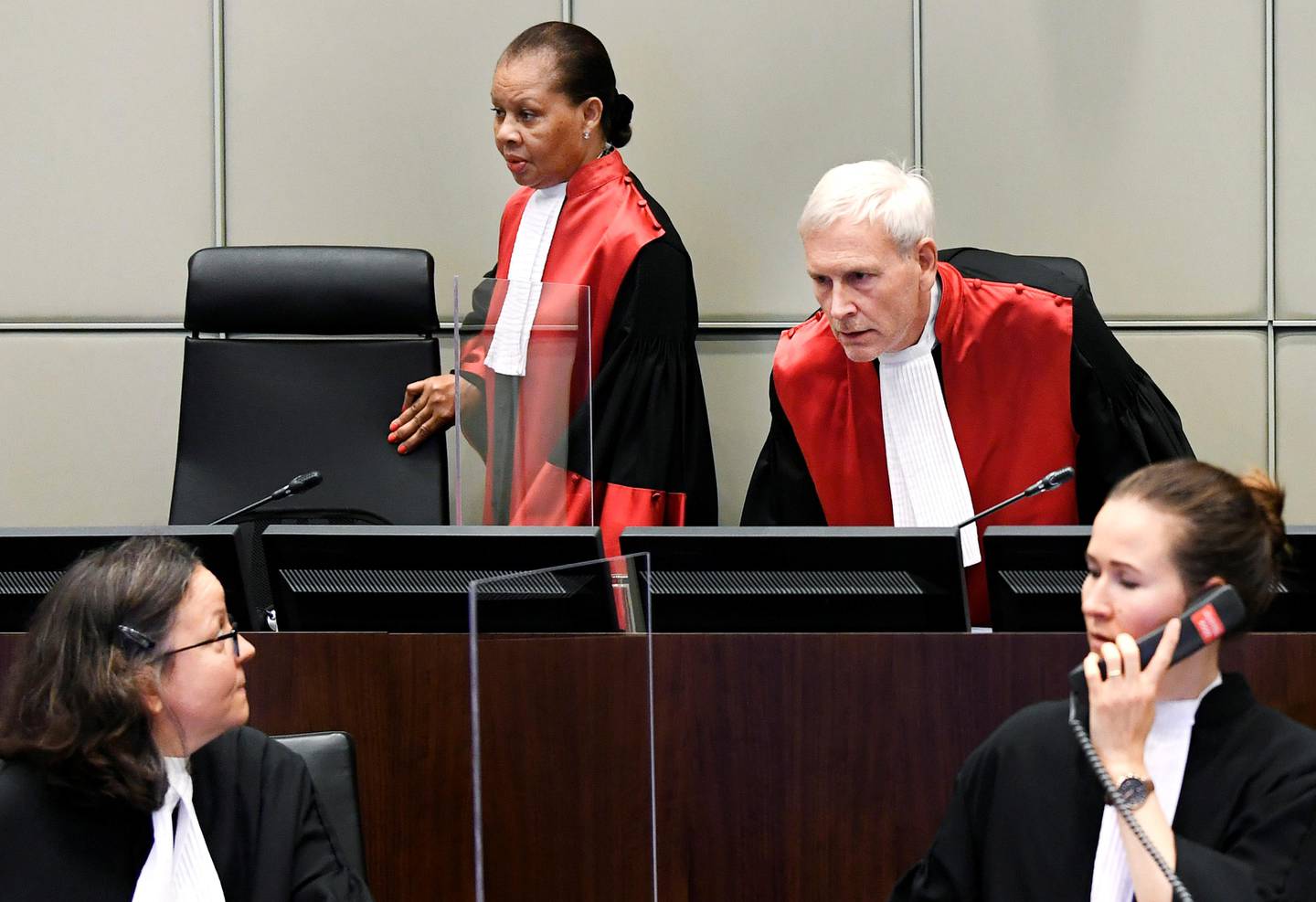 Judge David Re, Presiding Judge, and Judge Janet Nosworthy attend a session of the United Nations-backed Lebanon Tribunal handing down a judgement in the case of four men being tried in absentia for the 2005 bombing that killed former Prime Minister Rafik al-Hariri and 21 other people, in Leidschendam, Netherlands August 18, 2020.  REUTERS/Piroschka Van De Wouw/Pool