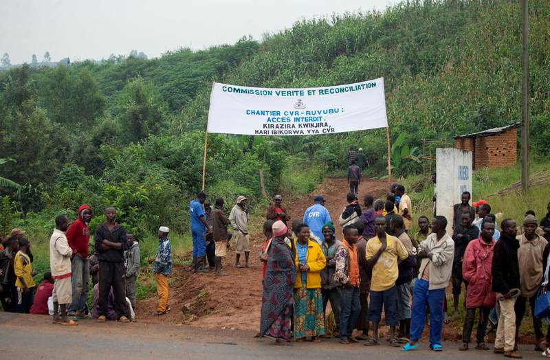 Burundian residents gather near the site of a mass grave in the Bukirasazi hill in Karusi Province, Burundi January 27, 2020. Picture taken January 27, 2020. REUTERS/Evrard Ngendakumana