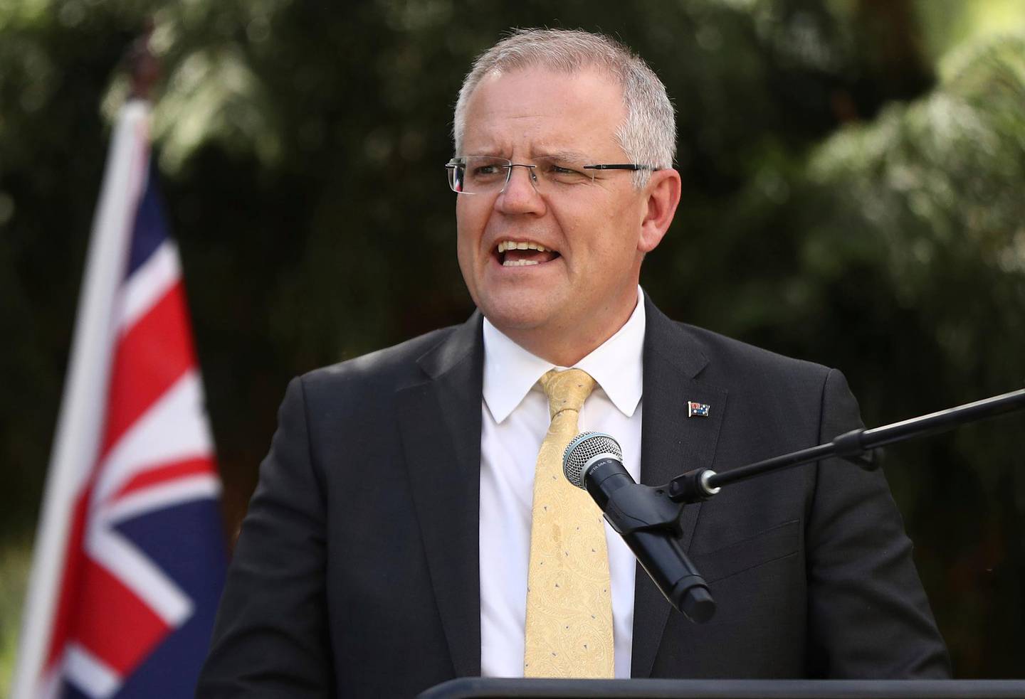 Australian Prime Minister Scott Morrison speaks during the unveiling of a Gandhi statue in the Sydney suburb of Parramatta, Thursday, Nov. 22, 2018. Earlier Morrison revealed plans to increase government powers to strip citizenship from extremists and to control the movements of Australian fighters who return home from the battlefields of Syria and Iraq. (Mark Metcalfe/Pool Photo via AP)