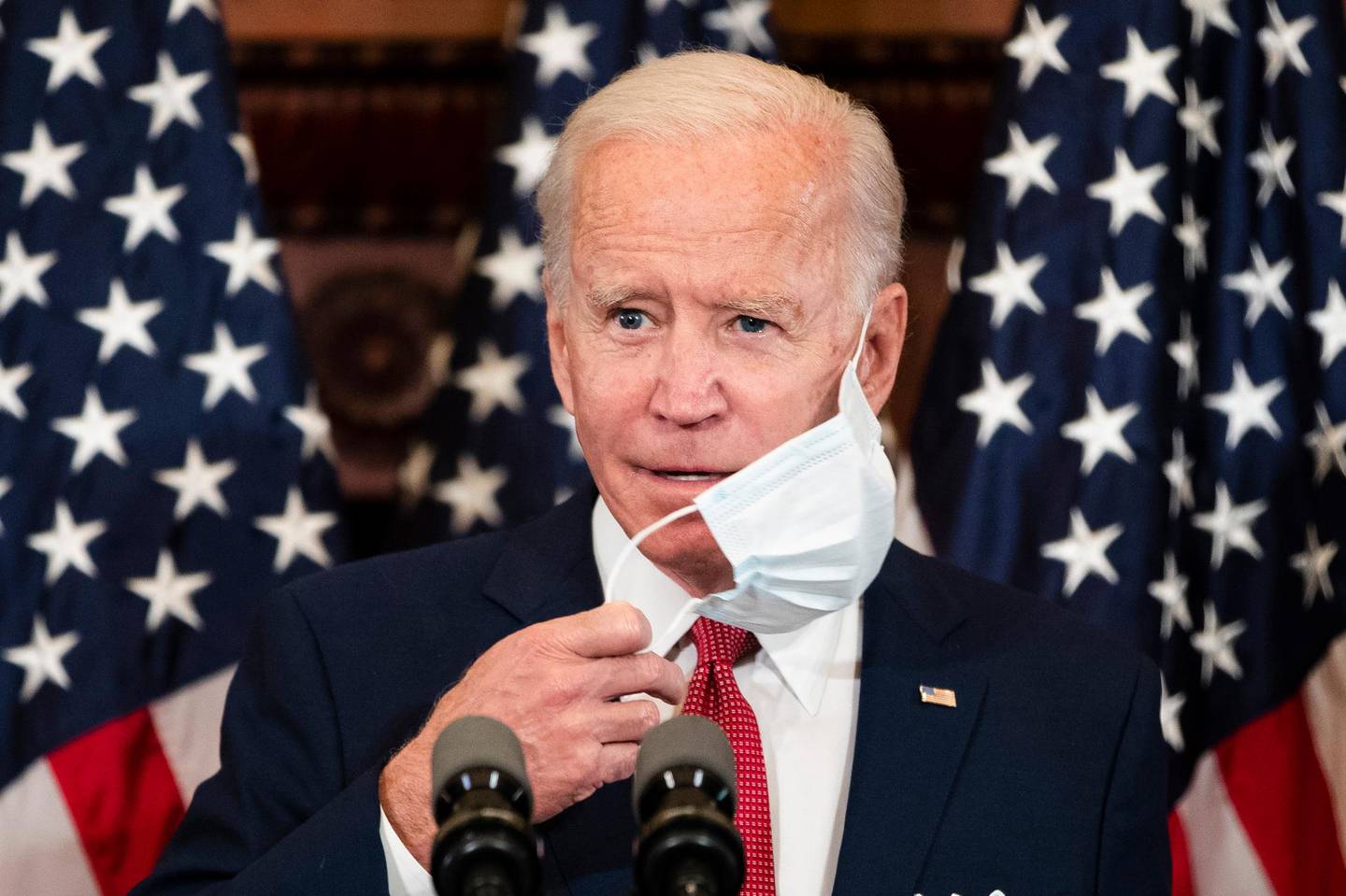 Democratic presidential candidate, former Vice President Joe Biden removes his mask as he speaks in Philadelphia, Tuesday, June 2, 2020. (AP Photo/Matt Rourke)