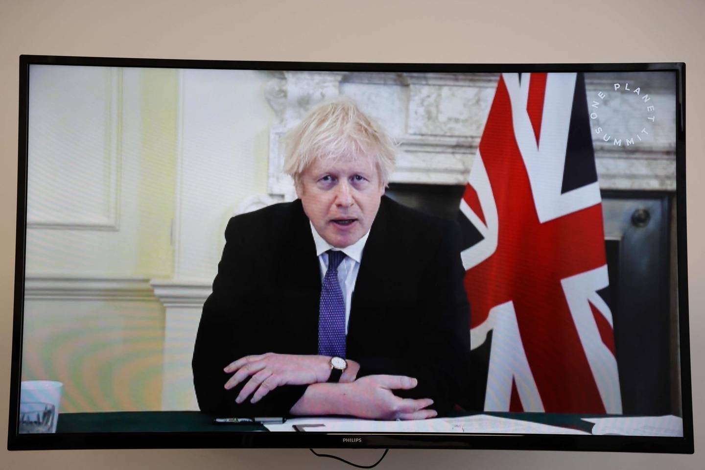 Britain's Prime Minister Boris Johnson speaks during a video conference at the One Planet Summit, part of World Nature Day, at the Reception Room of the Elysee Palace, in Paris, on January 11, 2021. - The One Planet Summit, a largely virtual event hosted by France in partnership with the United Nations and the World Bank, will include French President, German Chancellor and European Union chief. (Photo by Ludovic MARIN / various sources / AFP)