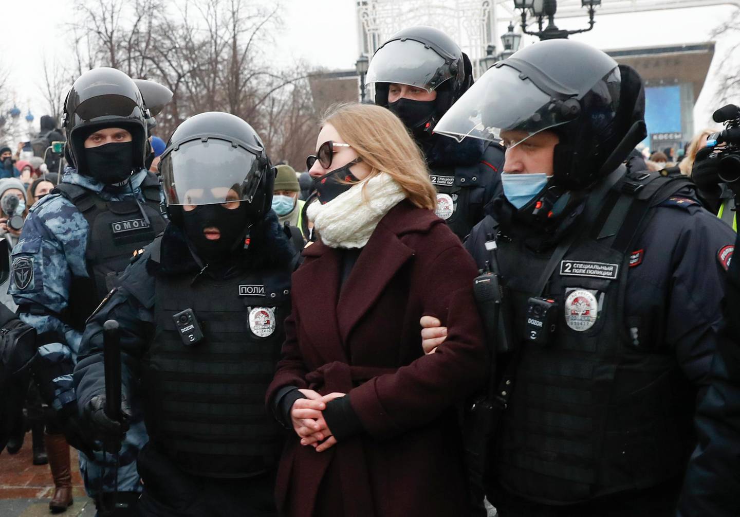 Police detain a woman during a protest against the jailing of opposition leader Alexei Navalny in Moscow, Russia, Saturday, Jan. 23, 2021. Russian police are arresting protesters demanding the release of top Russian opposition leader Alexei Navalny at demonstrations in the country's east and larger unsanctioned rallies are expected later Saturday in Moscow and other major cities. (AP Photo/Pavel Golovkin)