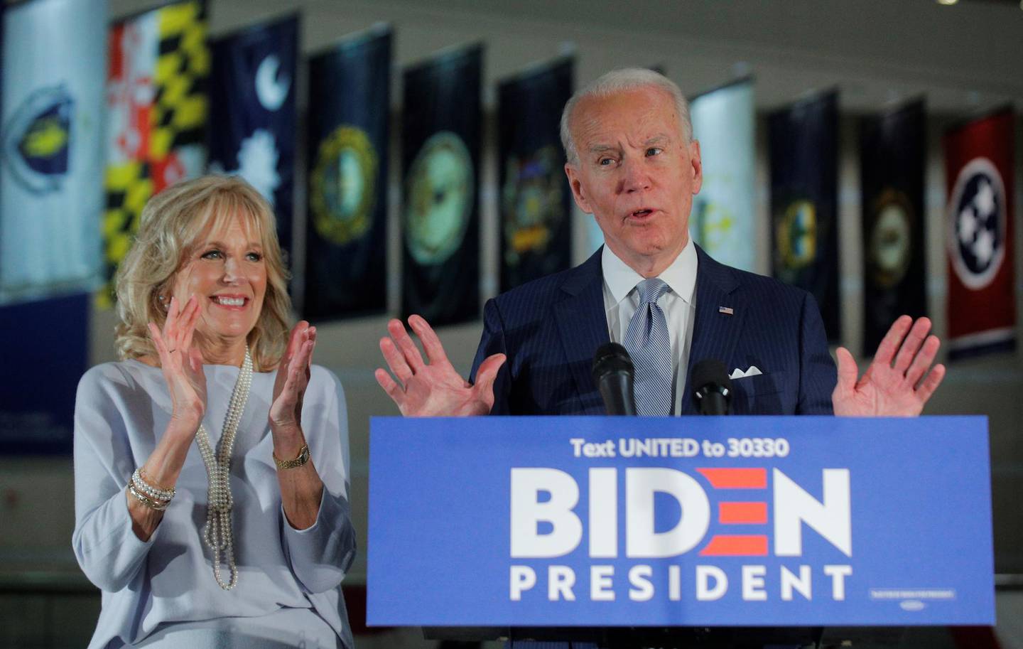 Democratic U.S. presidential candidate and former Vice President Joe Biden speaks with his wife Jill at his side during a primary night speech at The National Constitution Center in Philadelphia, Pennsylvania, U.S., March 10, 2020. REUTERS/Brendan McDermid