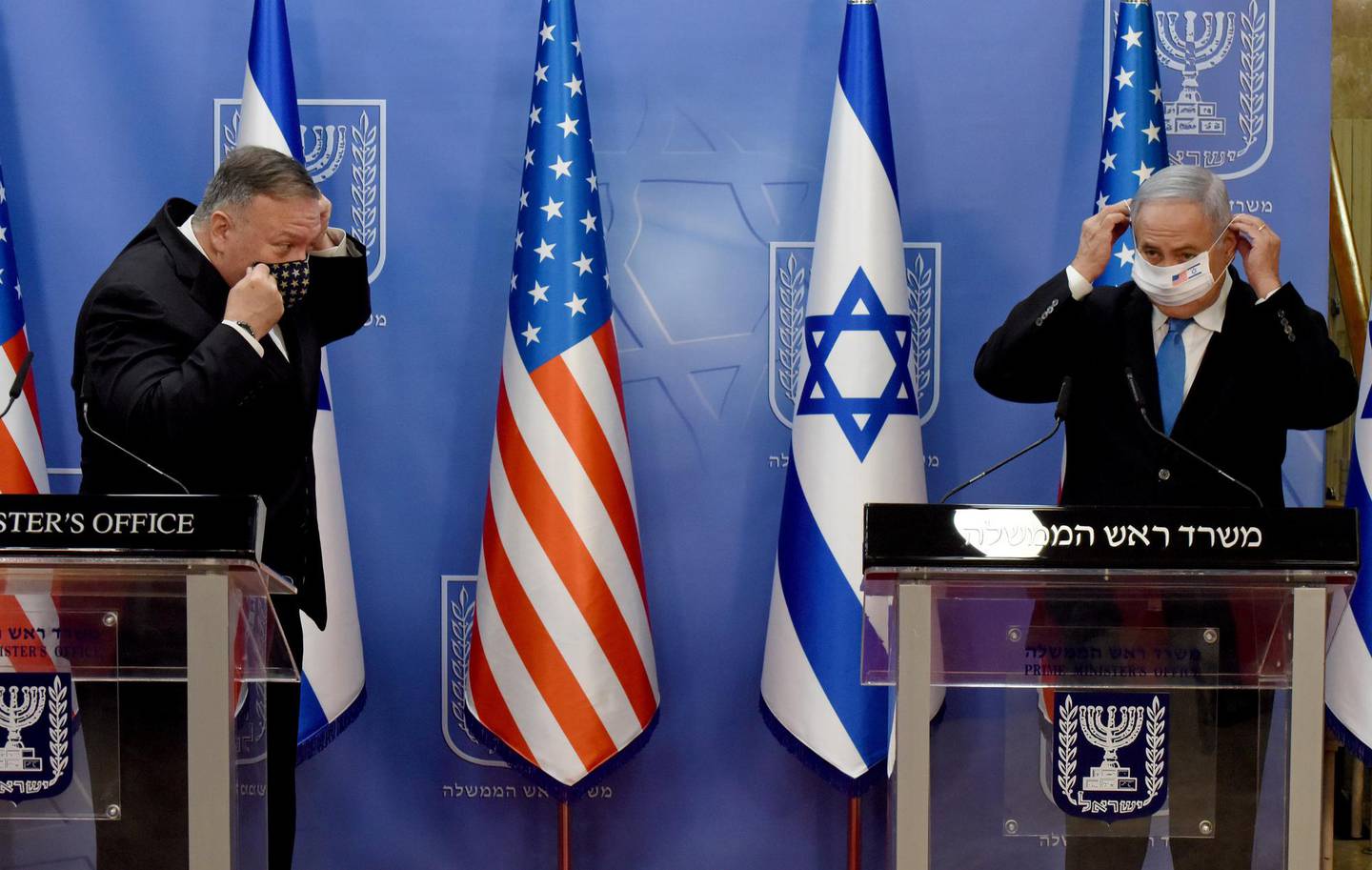 U.S. Secretary of State Mike Pompeo and Israeli Prime Minister Benjamin Netanyahu wear face masks after  a joint news conference in Jerusalem, August 24, 2020. Debbie Hill/Pool via REUTERS
