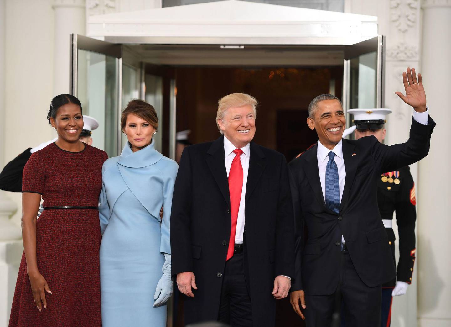 US President Barack Obama(R) and First Lady Michelle Obama(L) welcome Preisdent-elect Donald Trump(2nd-R) and his wife Melania to the White House in Washington, DC January 20, 2017.  / AFP PHOTO / JIM WATSON