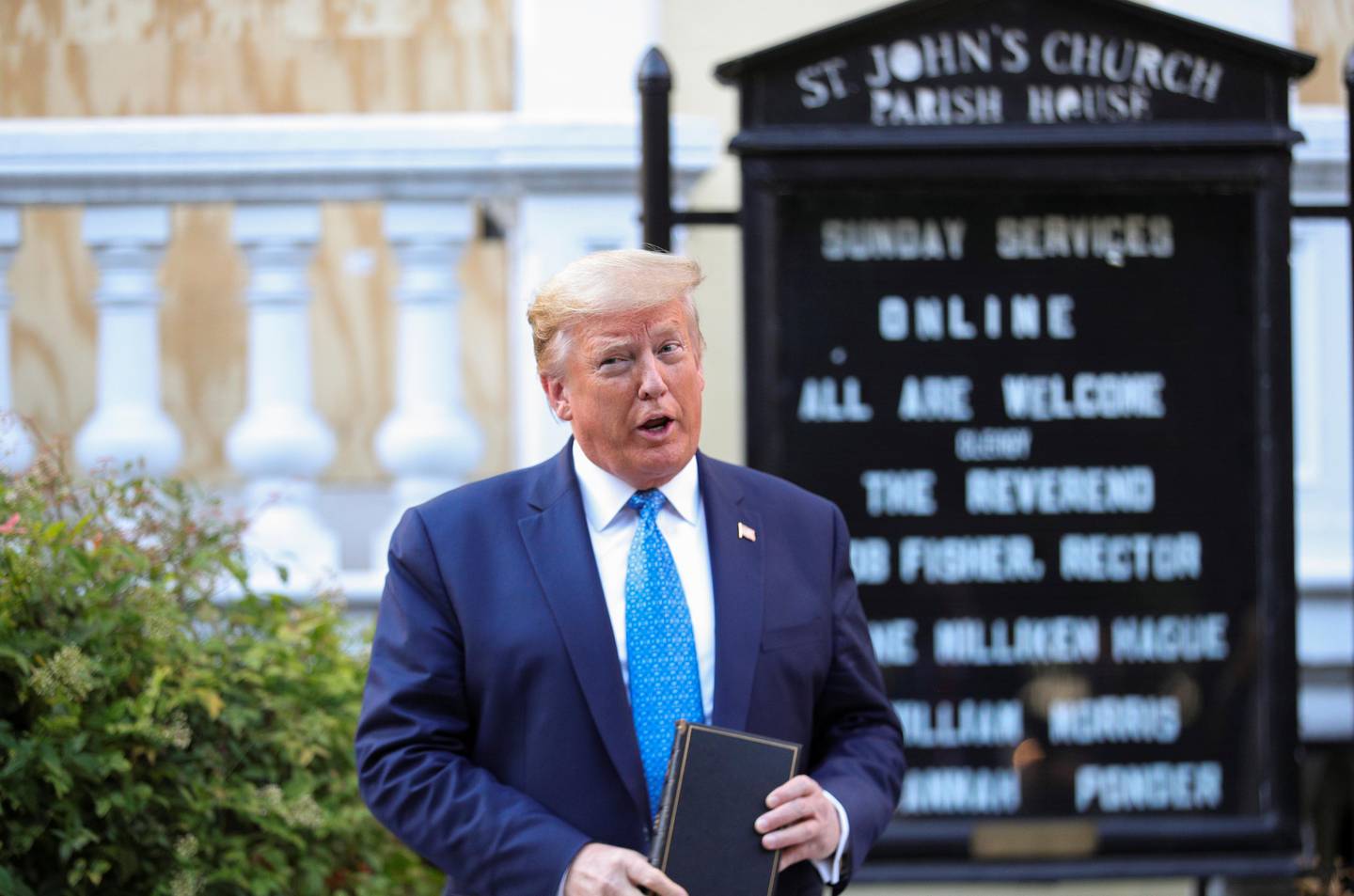 U.S. President Donald Trump talks to reporters as he holds a Bible during a photo opportunity in front of St. John's Episcopal Church in the midst of ongoing protests over racial inequality in the wake of the death of George Floyd while in Minneapolis police custody, outside the White House in Washington, U.S., June 1, 2020. REUTERS/Tom Brenner
