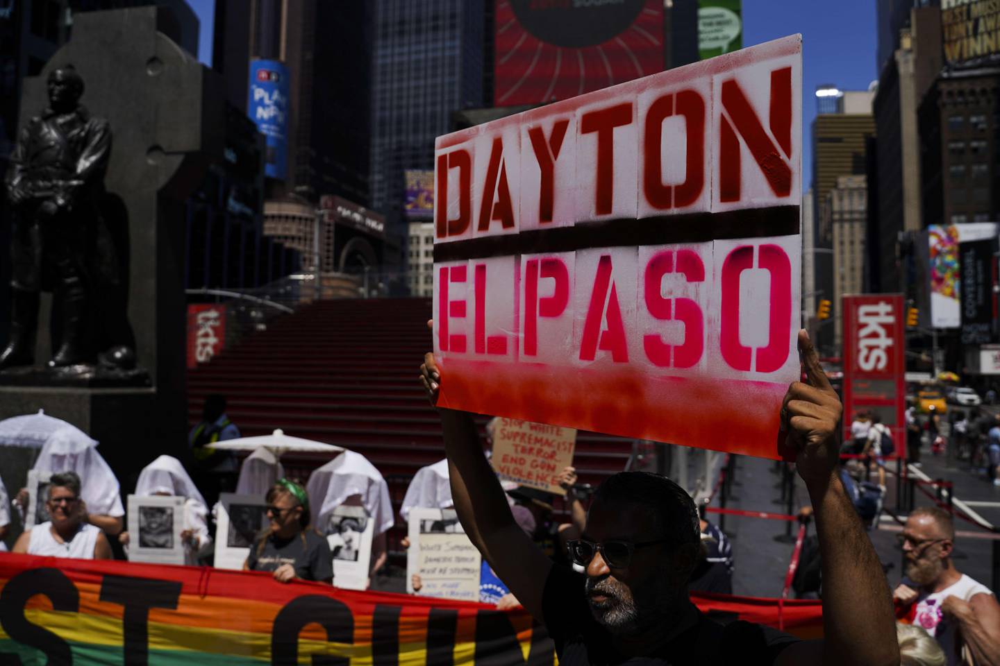 NEW YORK, NY - AUGUST 04: Protesters hold a rally against gun violence in Times Square in response to recent mass shootings in El Paso, Texas and Denton, Ohio on August 4, 2019 in New York City.   Go Nakamura/Getty Images/AFP
== FOR NEWSPAPERS, INTERNET, TELCOS & TELEVISION USE ONLY ==