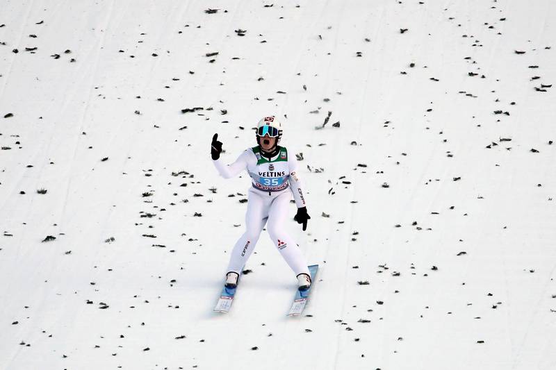 Norway's Marius Lindvik celebrates after the final round of the second stage of the 68th four hills ski jumping tournament in Garmisch-Partenkirchen, Germany, Wednesday, Jan. 1, 2020. (Daniel Karmann/dpa via AP)