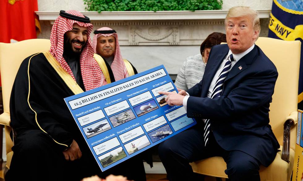 FILE - In this March 20, 2018 file photo, President Donald Trump shows a chart highlighting arms sales to Saudi Arabia during a meeting with Saudi Crown Prince Mohammed bin Salman in the Oval Office of the White House in Washington. The agreement between the United Arab Emirates and Israel to establish full diplomatic ties comes as little surprise to those closely following the nuances of Middle East politics, and Trump administrations almost single-minded push to broker a deal of this kind without a resolution first to the Israeli-Palestinian conflict. (AP Photo/Evan Vucci, File)