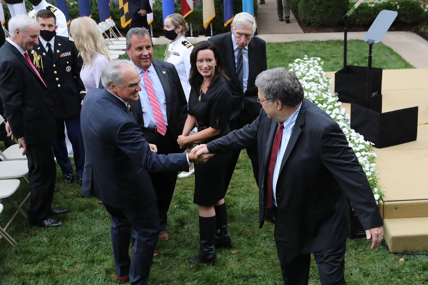 WASHINGTON, DC - SEPTEMBER 26: Attorney General William Barr (R) says goodbye to former New Jersey Governor Chris Christie and other guests after President Donald Trump introducee 7th U.S. Circuit Court Judge Amy Coney Barrett, 48, as his nominee to the Supreme Court in the Rose Garden at the White House September 26, 2020 in Washington, DC. With 38 days until the election, Trump tapped Barrett to be his third Supreme Court nominee in just four years and to replace the late Associate Justice Ruth Bader Ginsburg, who will be buried at Arlington National Cemetery on Tuesday.   Chip Somodevilla/Getty Images/AFP
== FOR NEWSPAPERS, INTERNET, TELCOS & TELEVISION USE ONLY ==