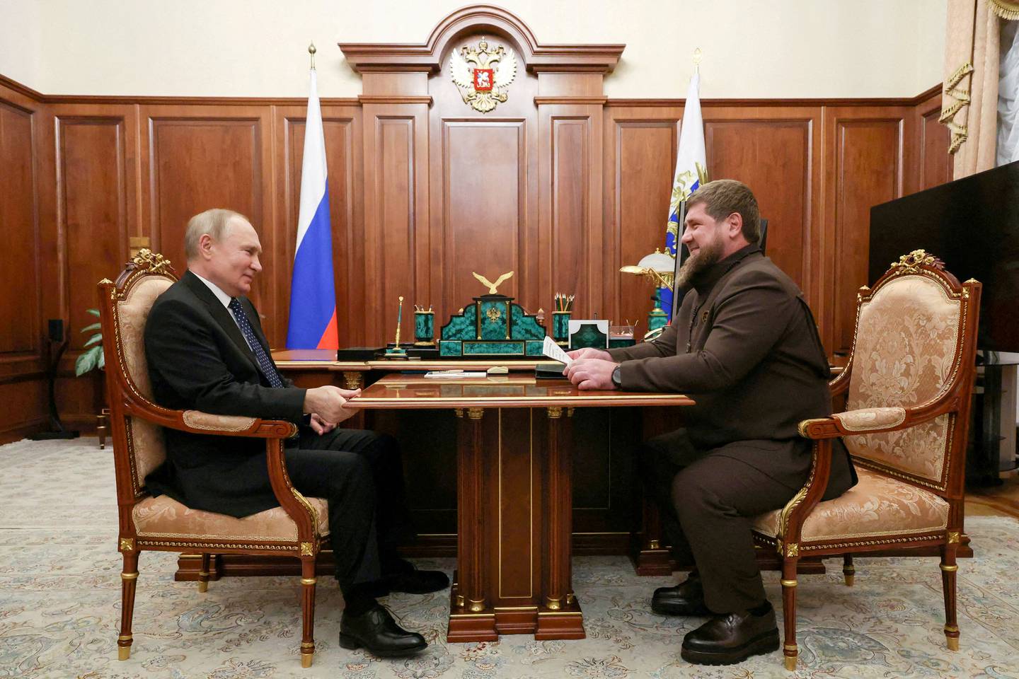 FILE PHOTO: Russia's President Vladimir Putin meets Head of the Chechen Republic Ramzan Kadyrov in Moscow, Russia March 13, 2023. Sputnik/Mikhail Klimentyev/Kremlin via REUTERS ATTENTION EDITORS - THIS IMAGE WAS PROVIDED BY A THIRD PARTY./File Photo