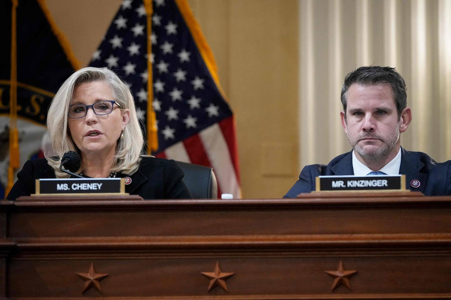 (FILES) In this file photo taken on December 1, 2021, US Republican Representatives Liz Cheney (L) and Adam Kinzinger listen during a select committee investigating the attack on the US Capitol, on December 1, 2021 in Washington, DC. - Republicans were set to censure Cheney and Kinzinge on February 4, 2022, in a significant escalation of the drive to oust dissidents seen as disloyal to former US President Donald Trump. Cheney and Kinzinger, the lone Republicans on the House committee investigating Trump's role in the January 6, 2021, US Capitol assault, are regarded as adversaries of the ex-president, who retains his iron grip on the party despite losing the 2020 election. (Photo by Drew Angerer / POOL / AFP)