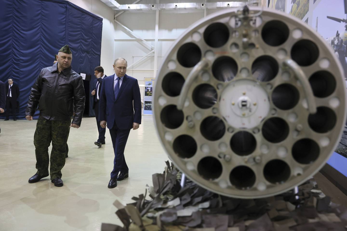 Russian President Vladimir Putin, center, and Alexander Karamyshev, Hero of Russia, and the head of aerial weapons training and tactical training center visit the 344th State Centre for Deployment and Retraining of Flight Personnel of the Russian Defense Ministry in Torzhok, Tver region, 217 km (136 miles) north-west of Moscow, Russia, Wednesday, March 27, 2024. (Mikhail Metzel, Sputnik, Kremlin Pool Photo via AP)