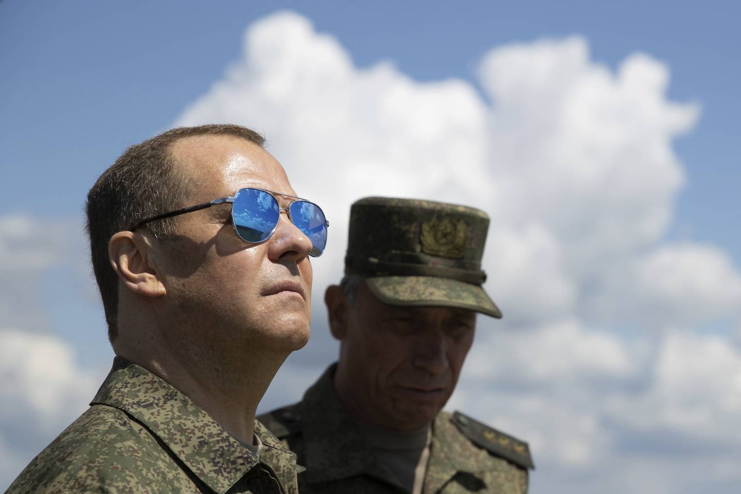 FILE - Russian Security Council Deputy Chairman and the head of the United Russia party Dmitry Medvedev, left, visits the Totsky military training ground in the Orenburg region, Russia, July 14, 2023. Medvedev, the deputy head of Russia's Security Council who served as a placeholder president in 2008-12 because Putin was term-limited, has unleashed near-daily threats that Moscow won't hesitate to use nuclear weapons. (Ekaterina Shtukina, Sputnik, Pool Photo via AP, File)