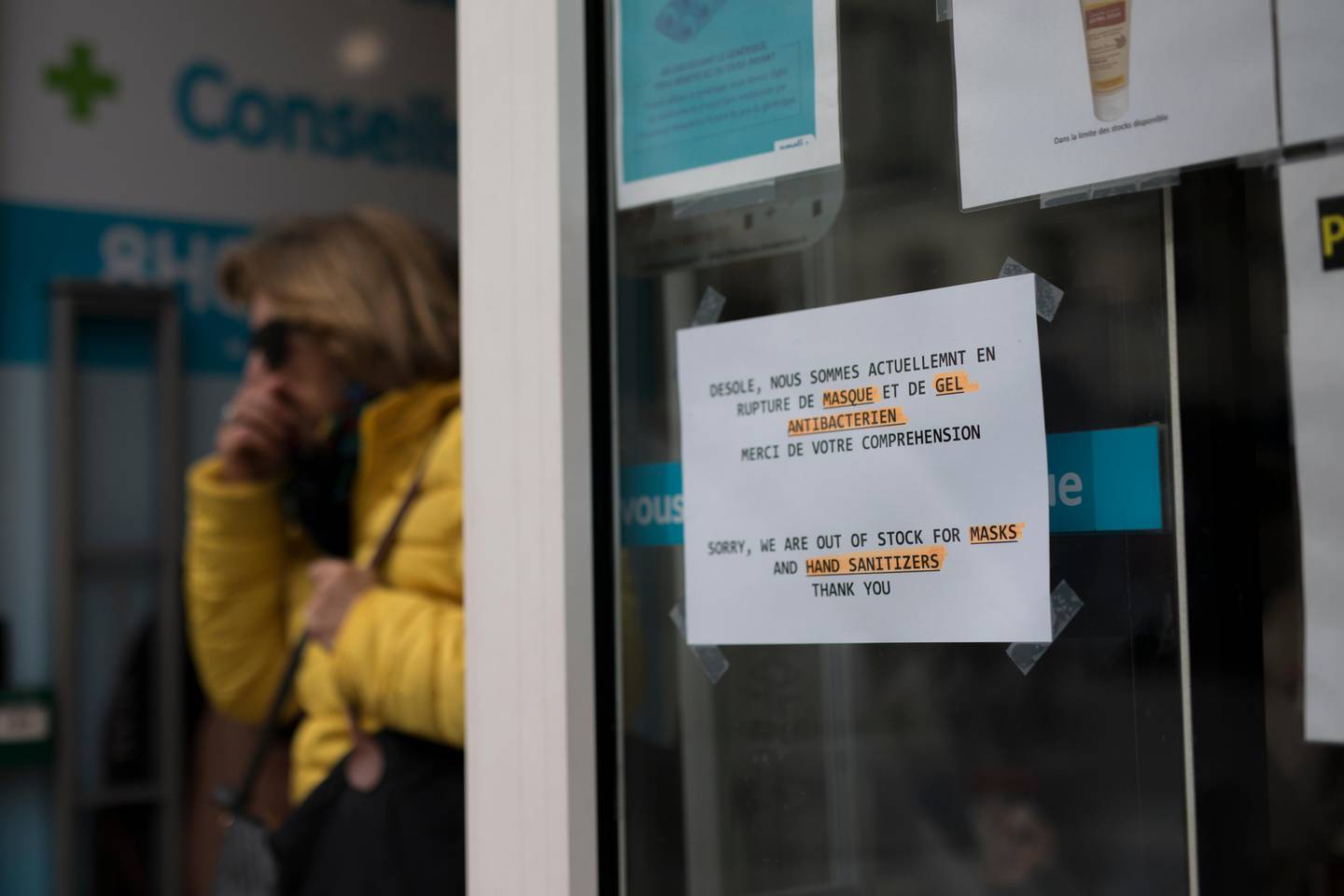 A sign is displayed at the entrance to a pharmacy in Marseille, southern France, Tuesday, March 3, 2020. As the new coronavirus takes hold in Europe, the continent is facing the same complications seen in Asia weeks ago. (AP Photo/Daniel Cole)
