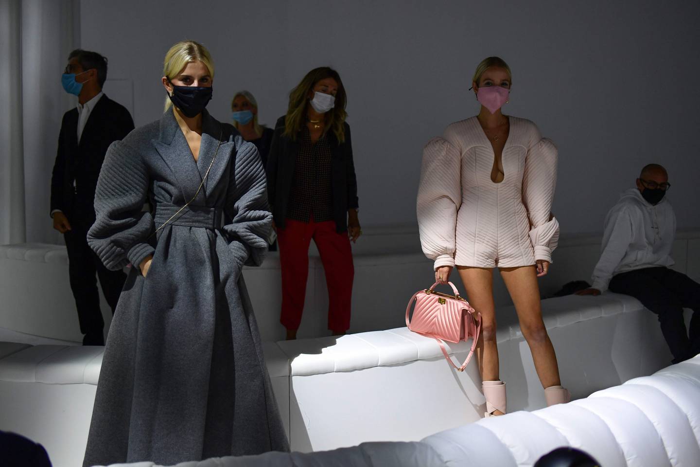 Guests wearing face masks and respecting social distances attend prior Fendi's Spring/Summer 2021 women's and mens collection during the Milan Fashion Week,  on September 23, 2020. (Photo by MIGUEL MEDINA / AFP)