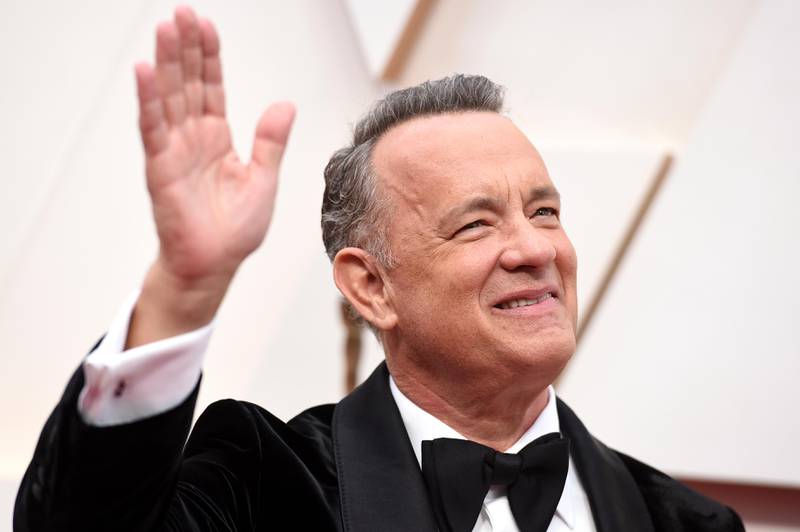 FILE - In this Sunday, Feb. 9, 2020 file photo, Tom Hanks arrives at the Oscars at the Dolby Theatre in Los Angeles. On Friday, May 15, 2020, The Associated Press reported on videos circulating online incorrectly asserting actor Tom Hanks and Chicago Mayor Lori Lightfoot support the New World Order, a conspiracy theory built on the idea that the worlds most wealthy and powerful are plotting to overthrow democracy and install a single, global authoritarian government. The clip featuring Hanks was taken from a five-minute video of him addressing the class of 2020 at Wright State University. (Photo by Jordan Strauss/Invision/AP)
