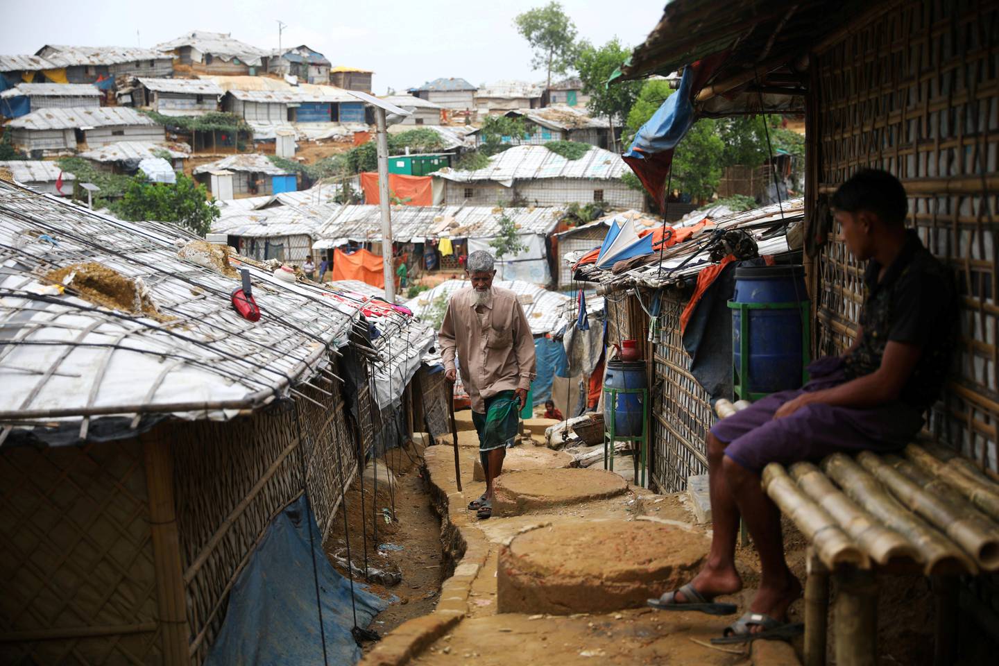 FILE PHOTO: A Rohingya refugee walks at a refugee camp in Cox's Bazar, Bangladesh, March 7, 2019. REUTERS/Mohammad Ponir Hossain -/File Photo