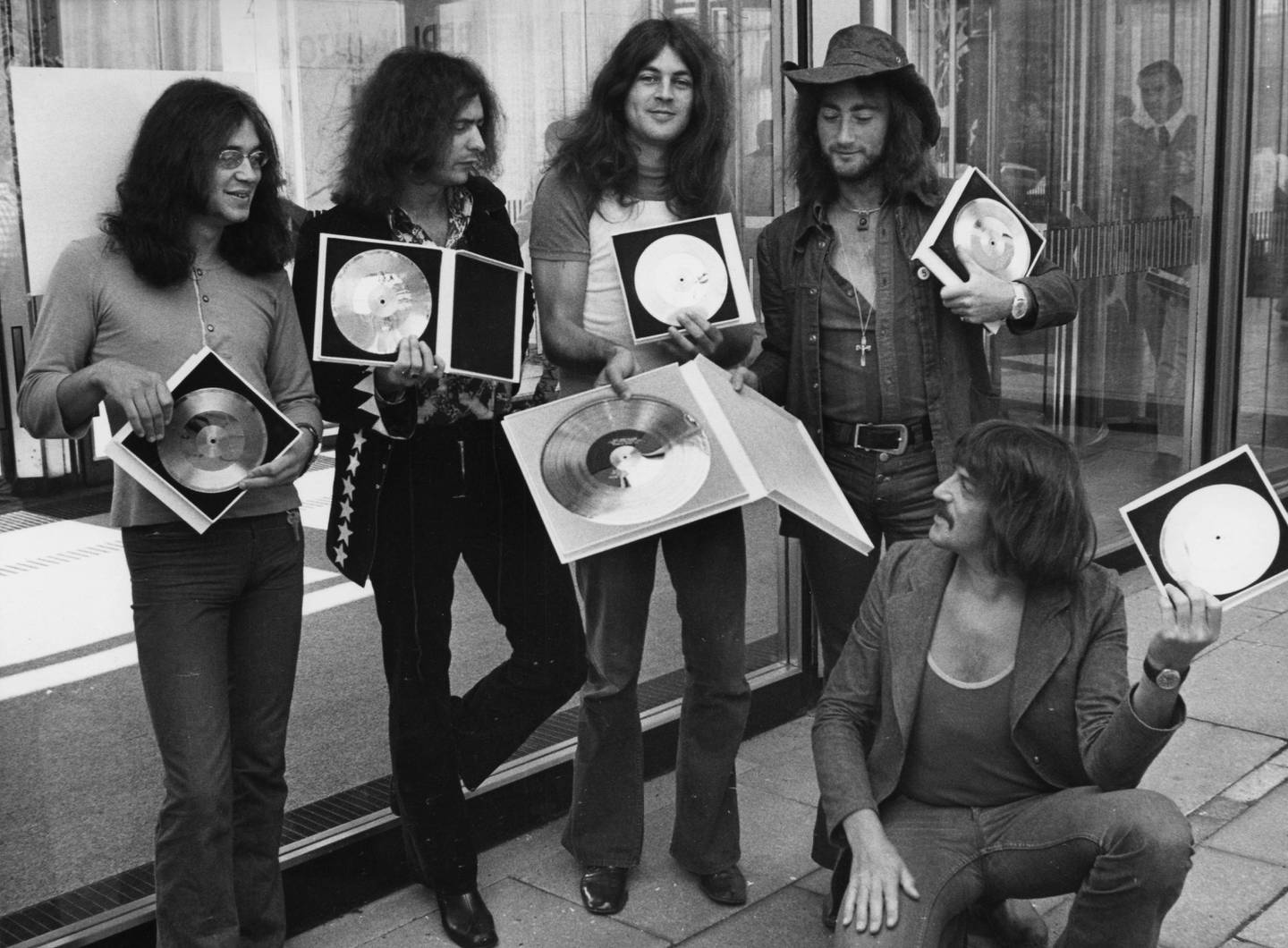 FILE - In this Sept. 1, 1971, file photo, British rock band Deep Purple present their golden record they received in West Berlin for the sales of their latest album, "Deep Purple in Rock," in West Germany. Deep Purple joins others as inductees in the 2016 class at the Rock and Roll Hall of Fame. The rock hall announced Thursday, Dec. 17, 2015, that Chicago, Cheap Trick, N.W.A. and Steve Miller will join as members in an April 8 induction ceremony in Brooklyn.  (AP Photo/Edwin Reichert, File)
